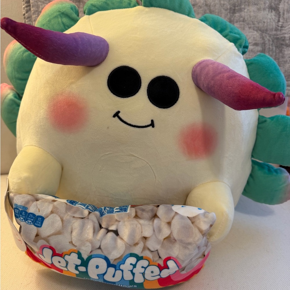 Plush Smiling Stuffed Animal with Purple and Green Accents